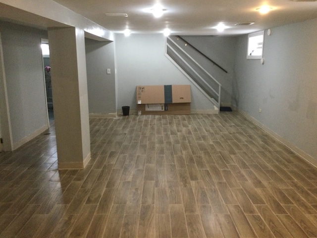 basement featuring dark hardwood / wood-style floors