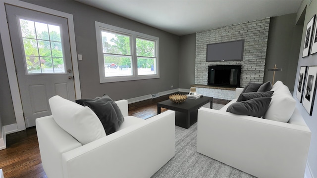 living room featuring a fireplace, plenty of natural light, and hardwood / wood-style flooring