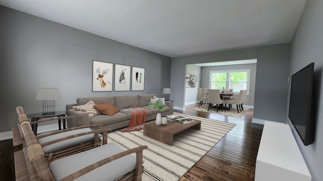living room with wood finished floors and baseboards