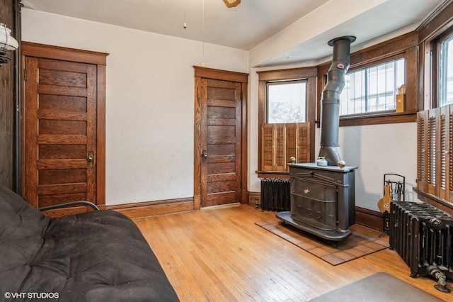 living room featuring radiator and light wood-type flooring