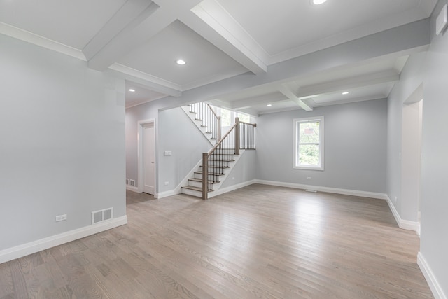 interior space featuring light hardwood / wood-style flooring, coffered ceiling, ornamental molding, and beam ceiling