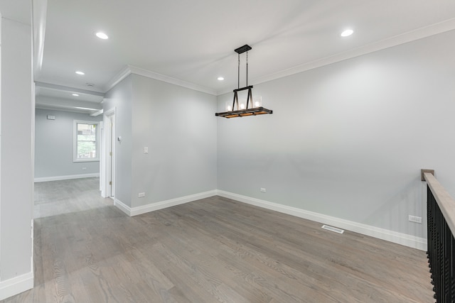 unfurnished dining area with ornamental molding and light hardwood / wood-style floors