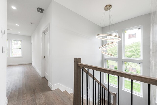 living room featuring ceiling fan and light hardwood / wood-style flooring