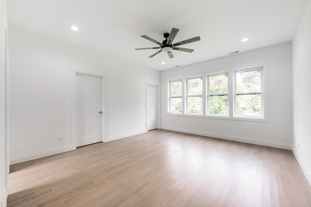 unfurnished room featuring light wood-type flooring and ceiling fan