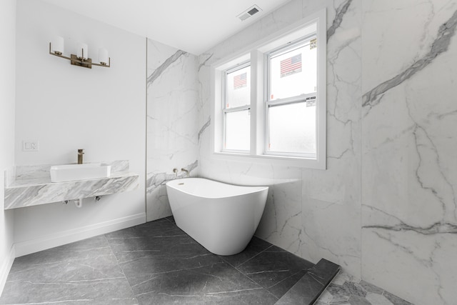 bathroom with sink and a bathing tub