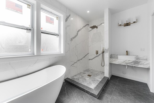 bathroom with vanity, toilet, and a tile shower