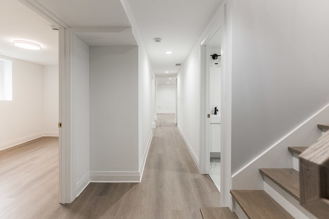 corridor featuring light hardwood / wood-style floors