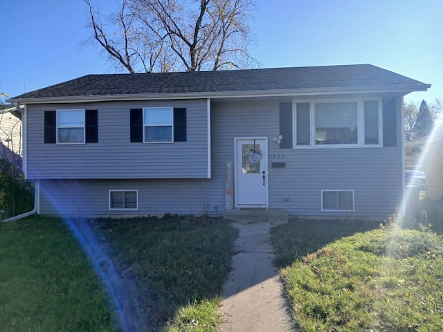 bi-level home with a front yard