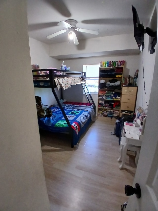 bedroom featuring hardwood / wood-style flooring and ceiling fan