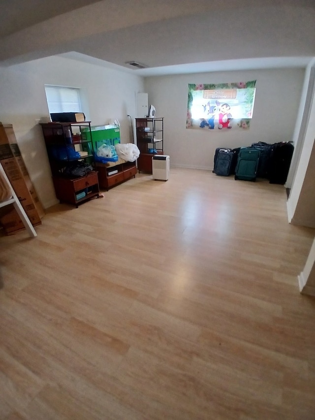 basement featuring light wood-type flooring