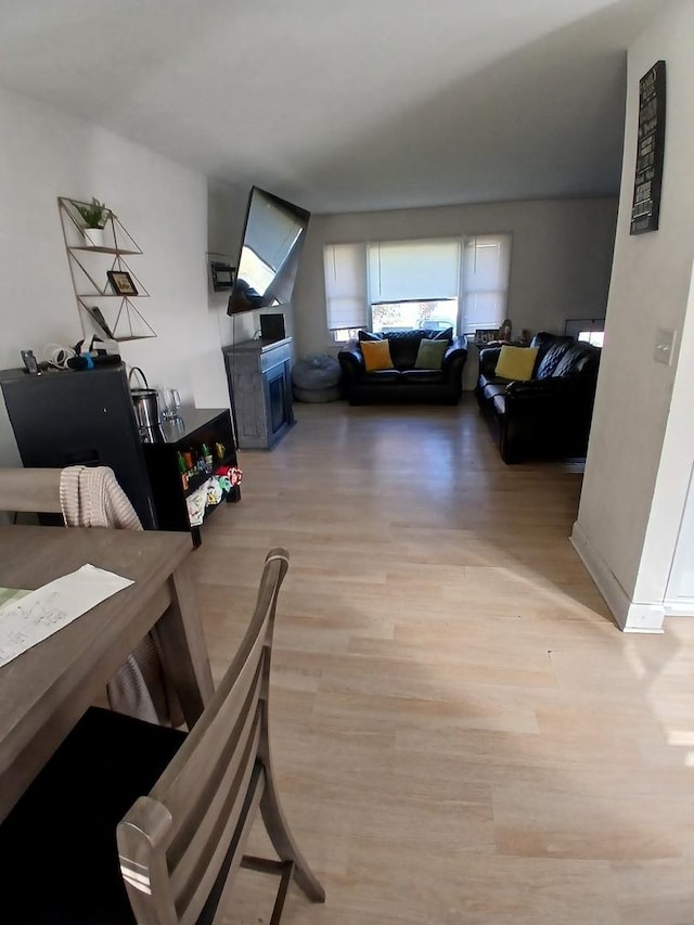 dining area featuring light wood finished floors