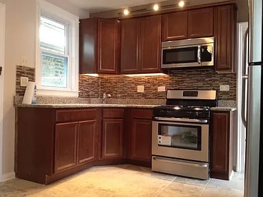 kitchen featuring sink, decorative backsplash, and appliances with stainless steel finishes