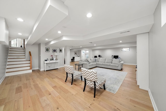 living room with light hardwood / wood-style flooring