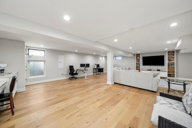 living room with light hardwood / wood-style flooring