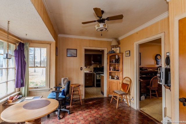 dining room featuring ceiling fan and crown molding