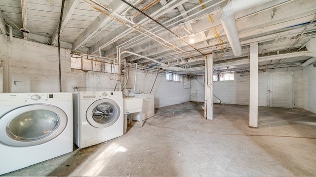 basement featuring washing machine and clothes dryer