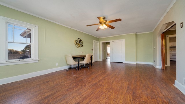 interior space with ceiling fan, dark hardwood / wood-style floors, and crown molding