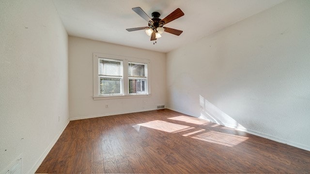 spare room with wood-type flooring and ceiling fan