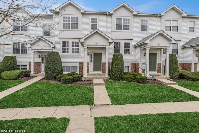 view of property featuring a front yard