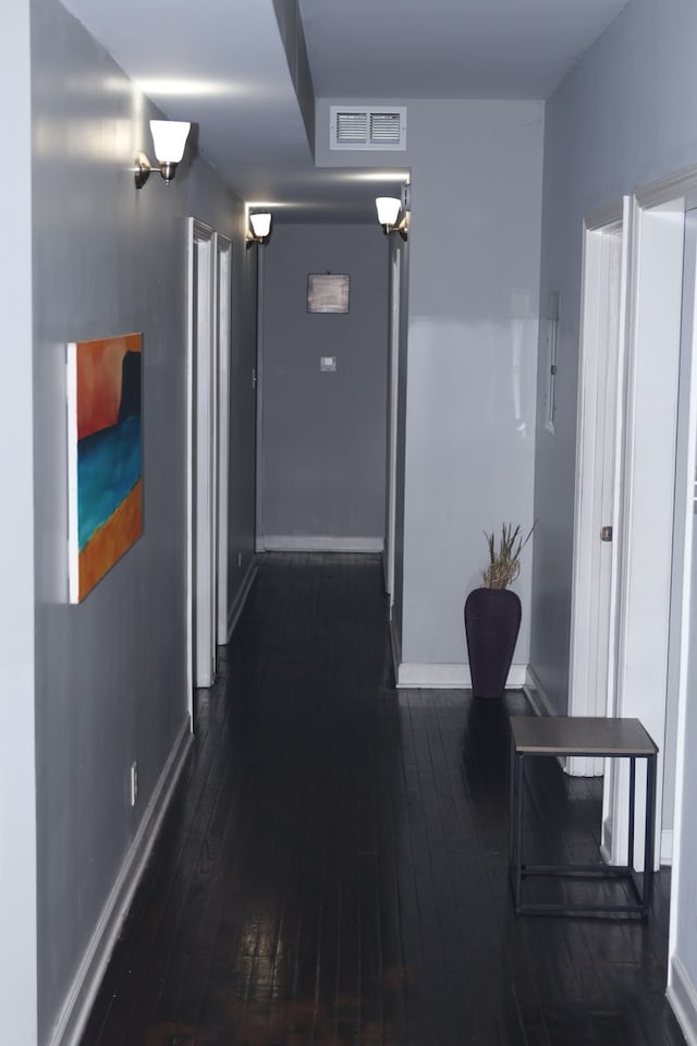 hallway featuring dark hardwood / wood-style floors