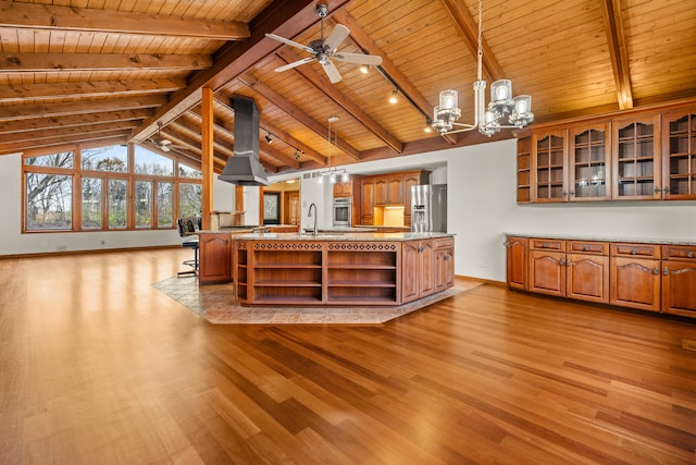 kitchen with wooden ceiling, light hardwood / wood-style flooring, pendant lighting, island range hood, and appliances with stainless steel finishes