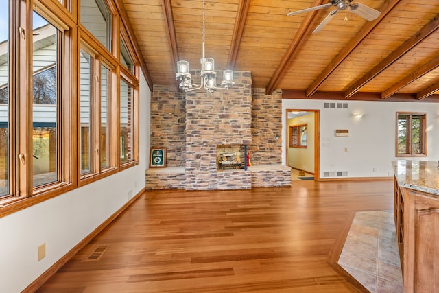 unfurnished living room with vaulted ceiling with beams, light hardwood / wood-style floors, wooden ceiling, and ceiling fan with notable chandelier