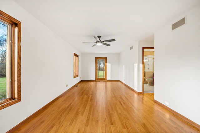 unfurnished room featuring ceiling fan and light hardwood / wood-style floors