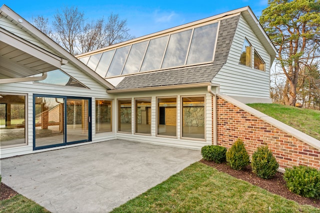 back of property with a patio area