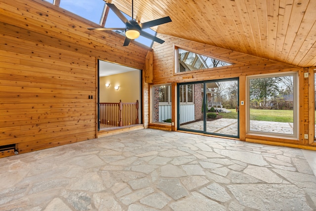 unfurnished sunroom featuring ceiling fan, lofted ceiling, and wood ceiling