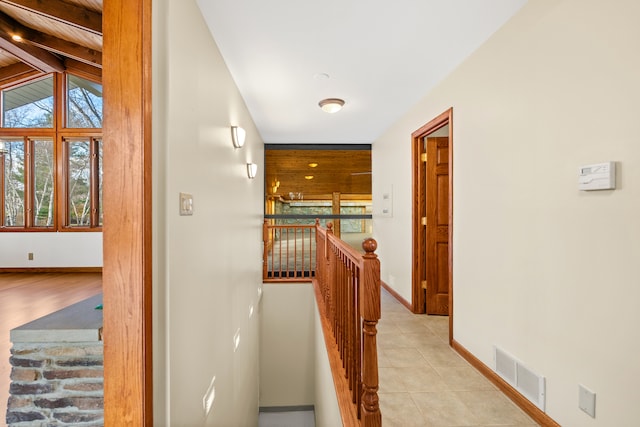 corridor featuring lofted ceiling with beams and light hardwood / wood-style floors