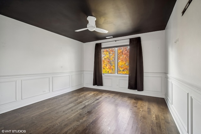 unfurnished room featuring ceiling fan and dark hardwood / wood-style flooring