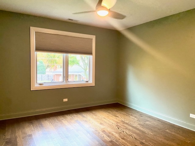 unfurnished room with ceiling fan and light hardwood / wood-style floors