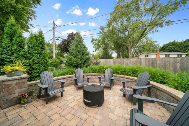 view of patio with an outdoor fire pit