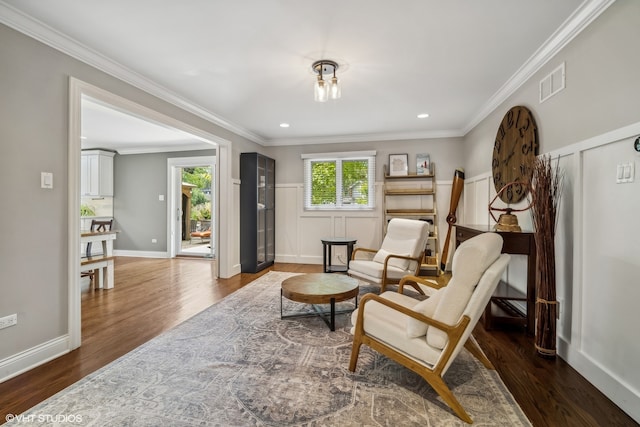 sitting room featuring dark hardwood / wood-style flooring and crown molding