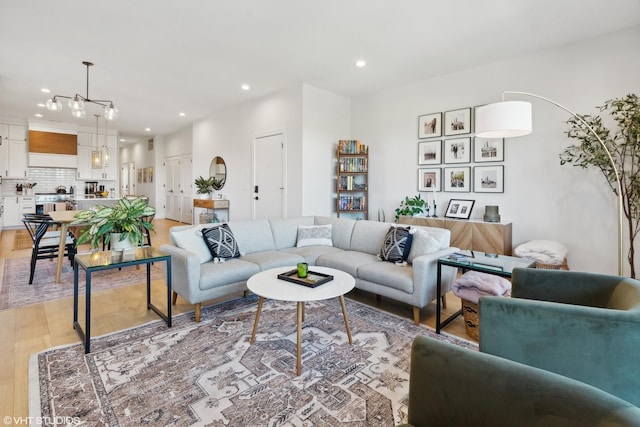 living room with recessed lighting and light wood-type flooring