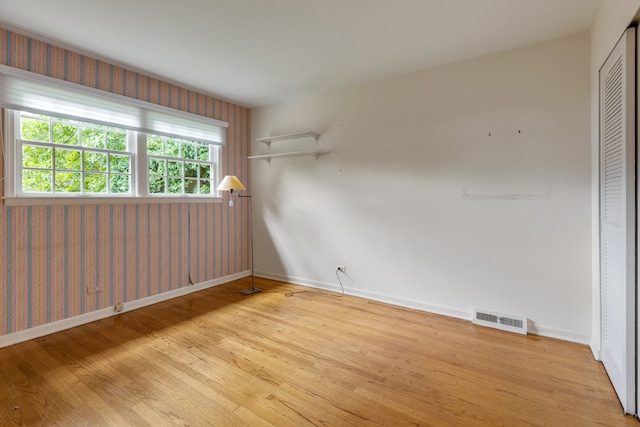 spare room with light hardwood / wood-style flooring