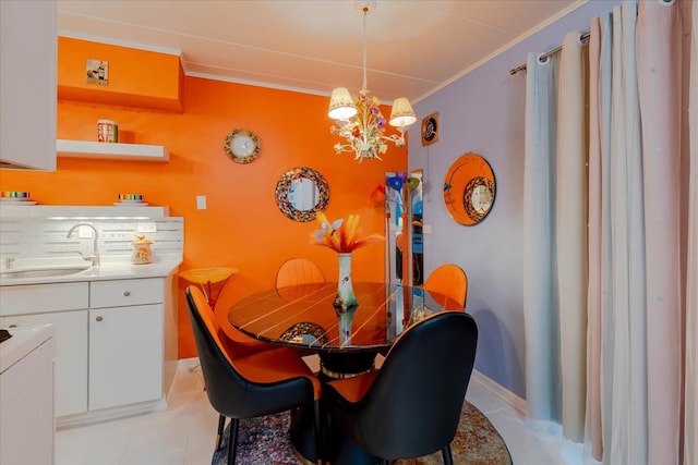 dining area with a notable chandelier, sink, crown molding, and light tile patterned floors