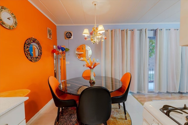 dining room with a chandelier and crown molding