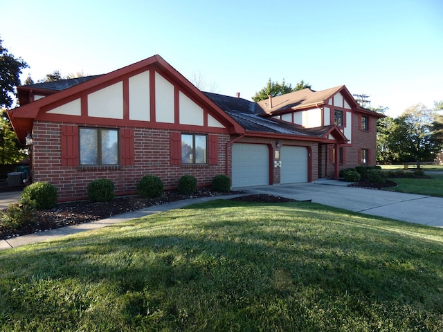 view of front of house with central air condition unit, a garage, and a front yard