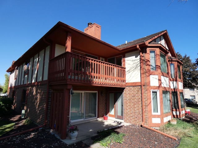 rear view of property featuring a patio