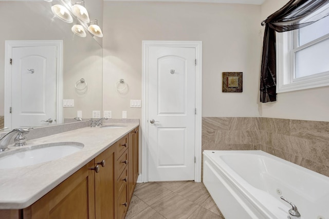 full bath featuring a whirlpool tub, double vanity, tile patterned flooring, and a sink