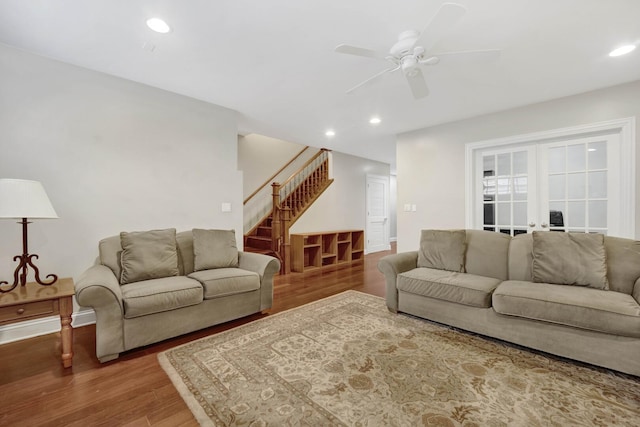 living room with a ceiling fan, stairway, wood finished floors, and recessed lighting