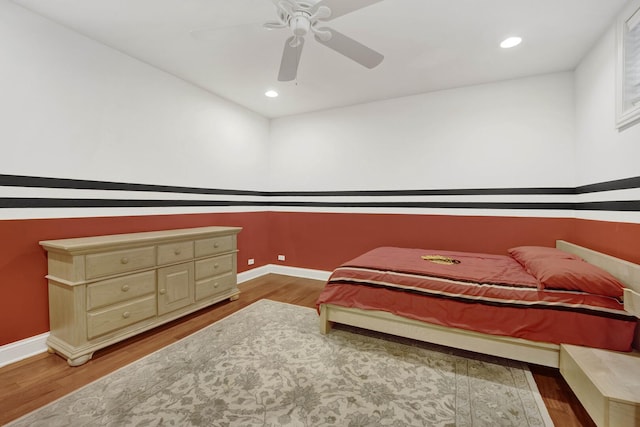 bedroom with a ceiling fan, baseboards, wood finished floors, and recessed lighting