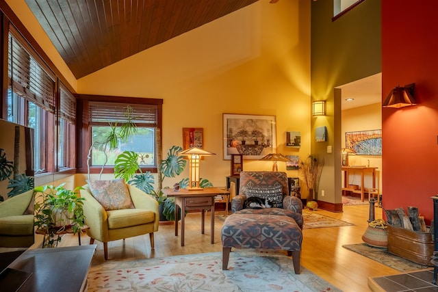 living area featuring wood ceiling, light hardwood / wood-style flooring, and high vaulted ceiling