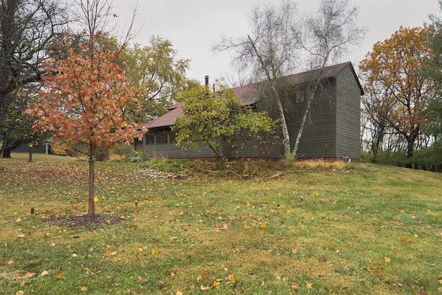 view of property exterior featuring a yard