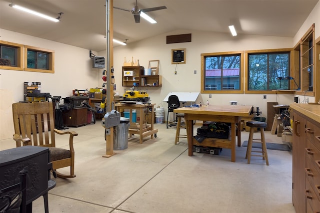 dining area featuring a workshop area, ceiling fan, and lofted ceiling