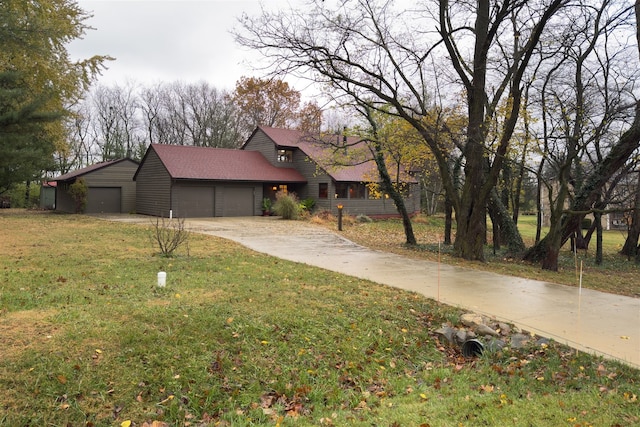 view of front of home with a garage and a front yard