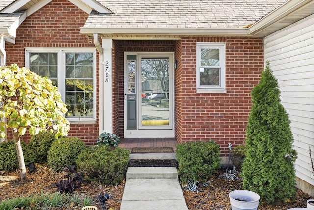 2708 Lake Shore Dr Unit 1, Joliet, IL 60431 - property entrance featuring brick siding and a shingled roof