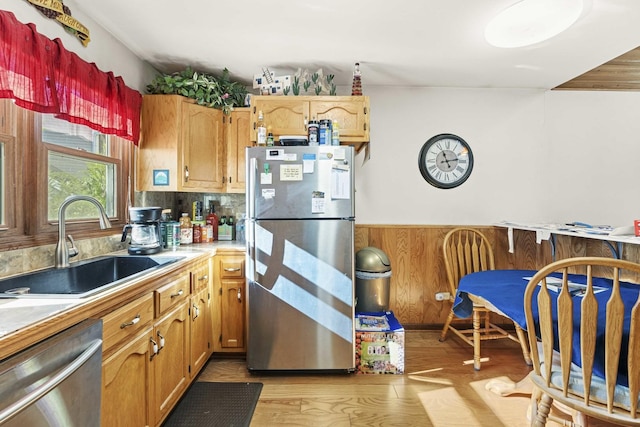 2708 Lake Shore Dr Unit 1, Joliet, IL 60431 - kitchen with appliances with stainless steel finishes, a sink, a wainscoted wall, light wood-type flooring, and wooden walls