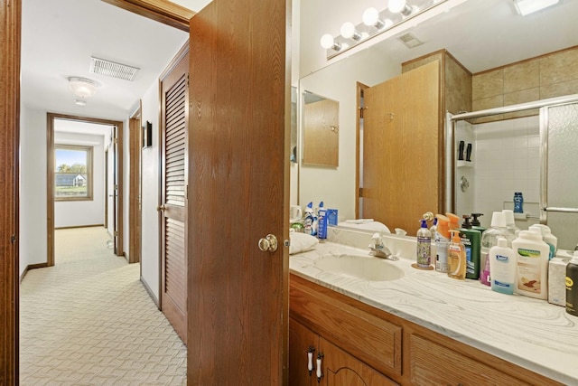 2708 Lake Shore Dr Unit 1, Joliet, IL 60431 - bathroom with a stall shower and vanity